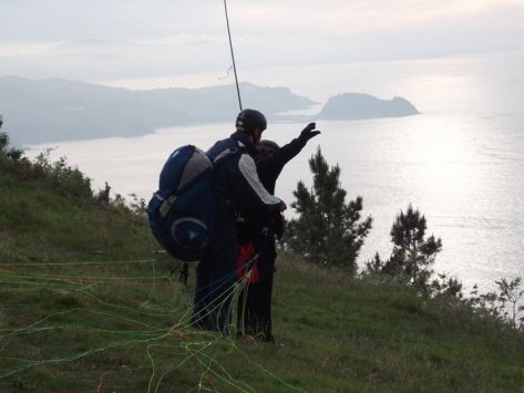 My instructor prepares me for our tandem take-off paragliding in Bilbao, Spain.